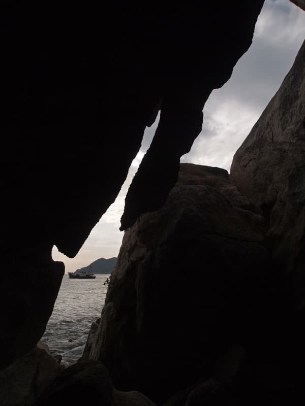 cheung chau view through rocks